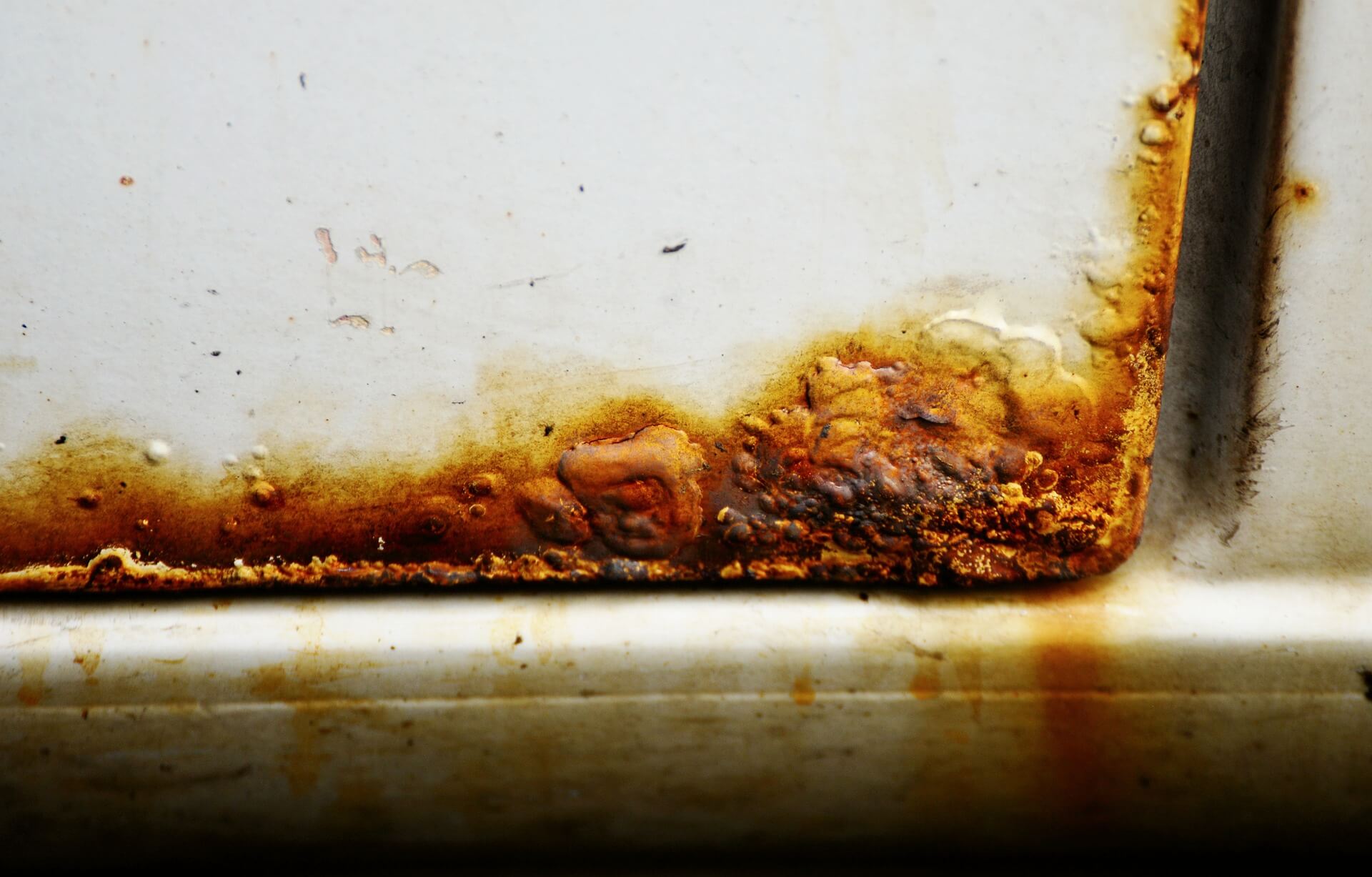 rust on bottom car door