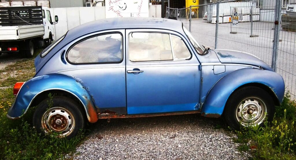 VW Beetle car with rust needing a repair