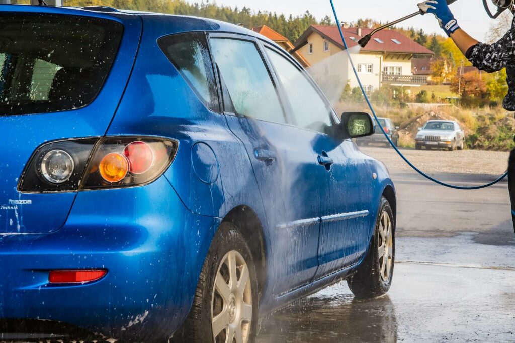 washing car with hose