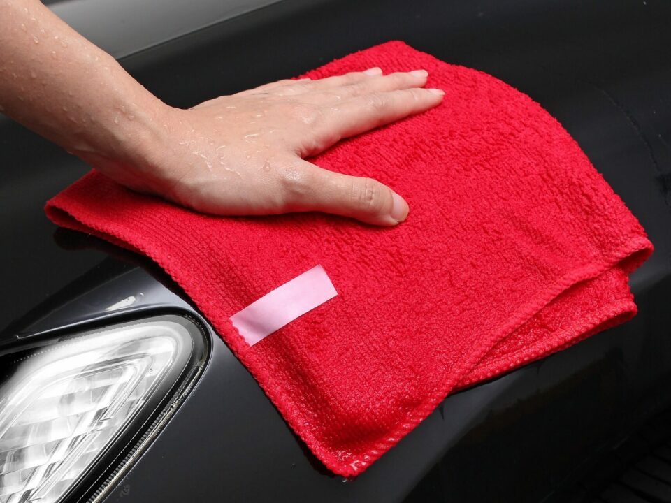 buffing car wax with microfiber cloth