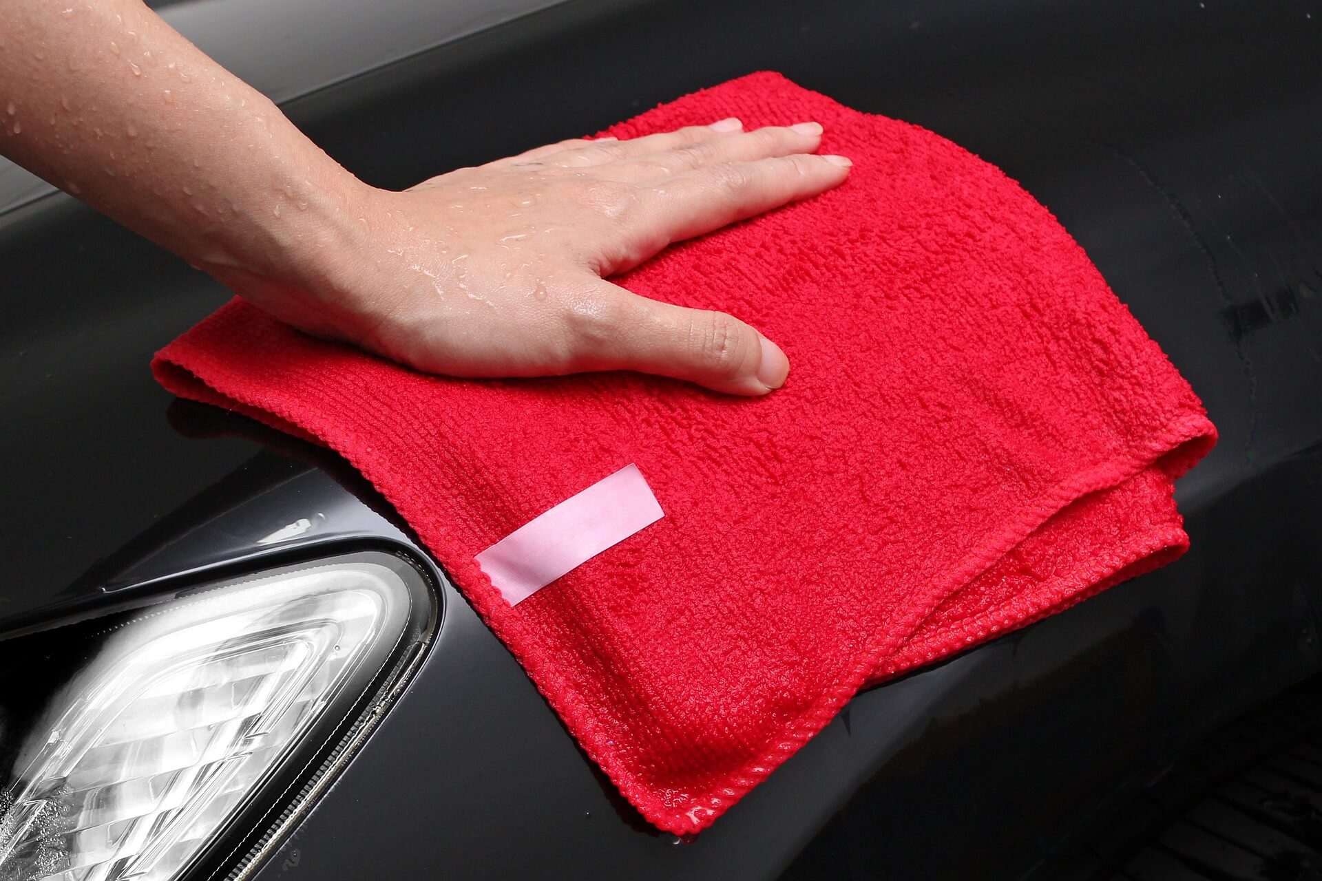 buffing car wax with microfiber cloth