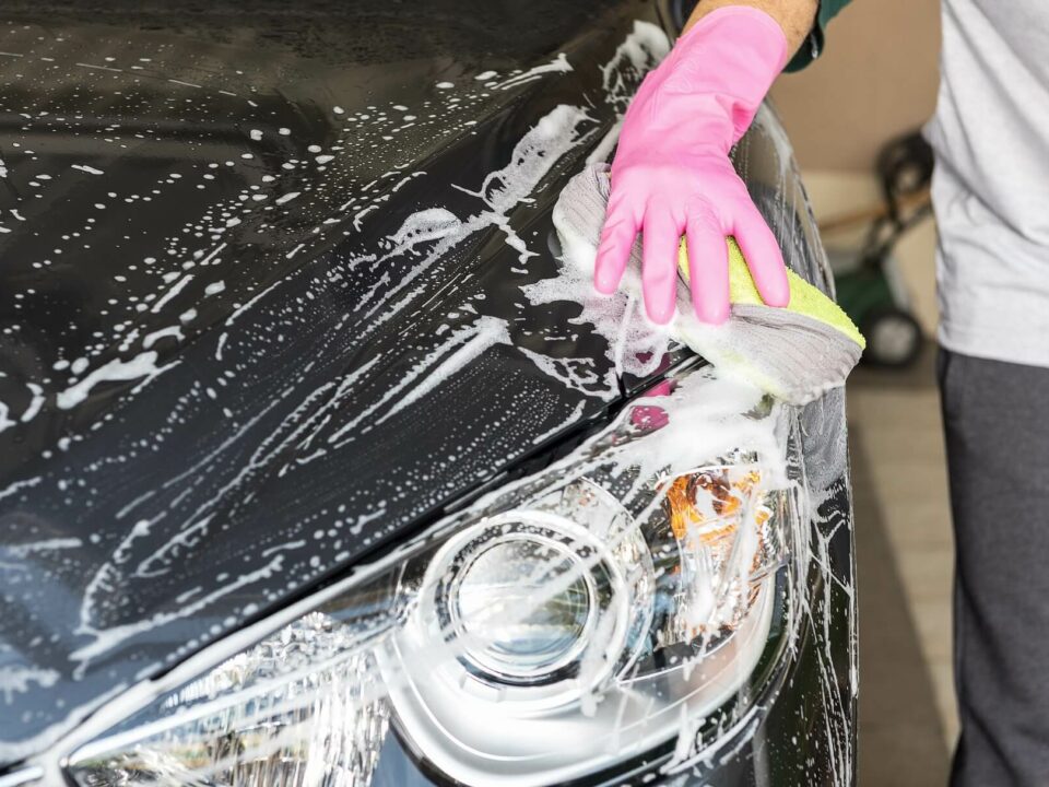 washing car with soapy cloth