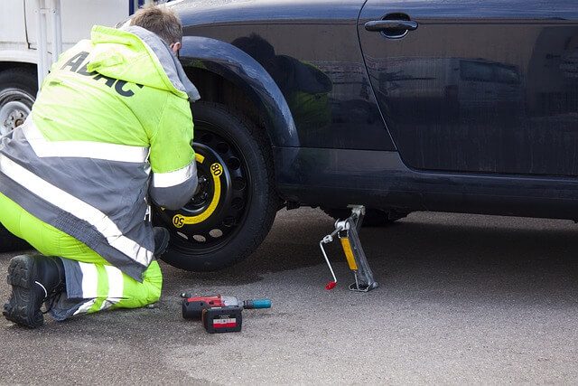 changing flat car tyre