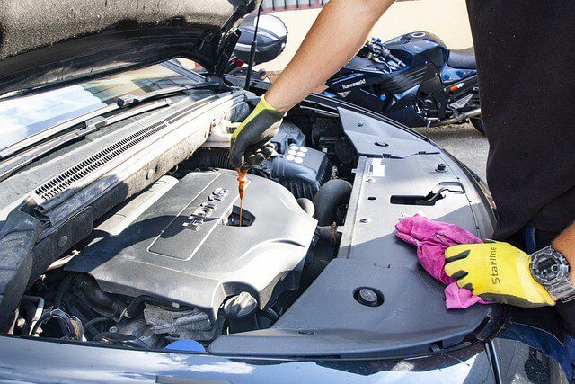 mechanic doing oil change