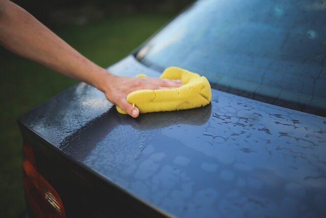cleaning car with cloth